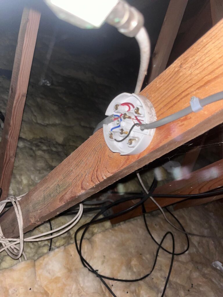 Poor electrical connection found in a loft during an EICR inspection.